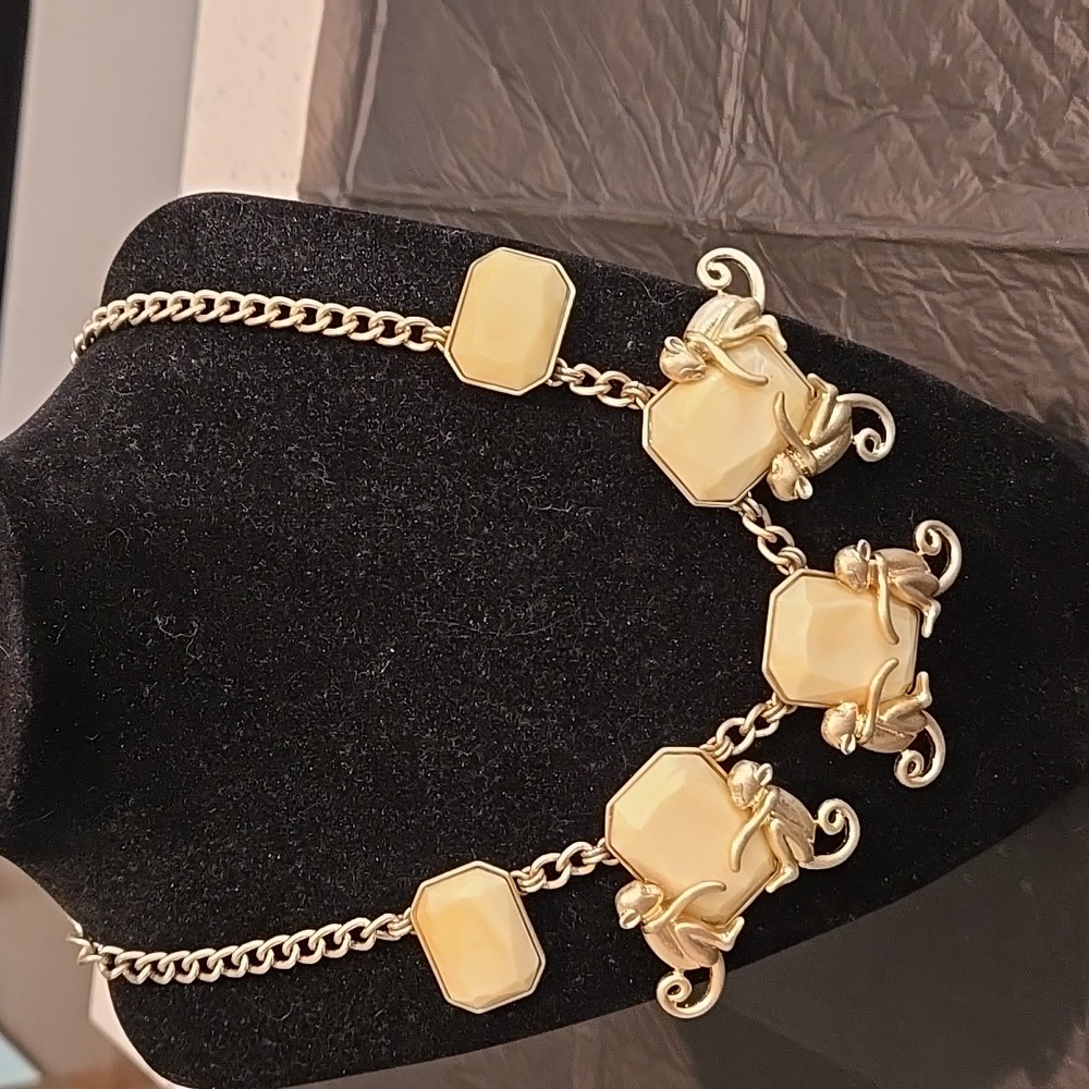 Gold Tone decorative necklace with monkees